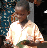 Africa_ChildReadingBook.gif
